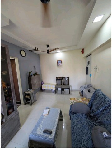 Living Room in 1 BHK Apartment at Raunak Unnathi Woods Phase 7 A And B, Ghodbunder Road – for Sale