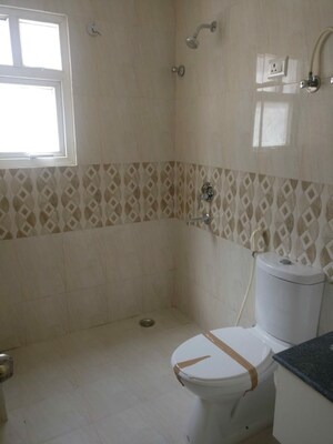 Bathroom in 3 BHK Apartment at Oxirich Avenue, Ahinsa Khand 2 – for Rent