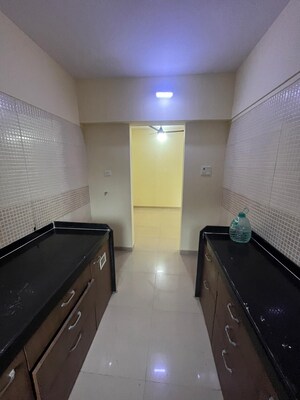 Kitchen in 2 BHK Apartment at Sudarshan Sky Garden, Ghodbunder Road – for Sale