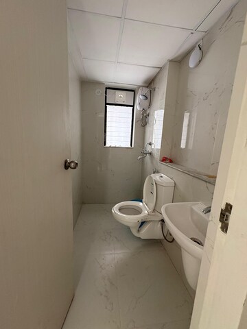 Bathroom in 1 BHK Apartment at Runwal Gardens, Dombivli East – for Rent