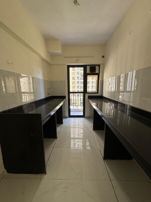 Kitchen in 2 BHK Apartment at Runwal Gardens Phase I, Dombivli East – for Rent