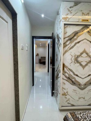 Building Lobby in 2 BHK Apartment at Rodas Enclave Evergreen, Patlipada – for Rent