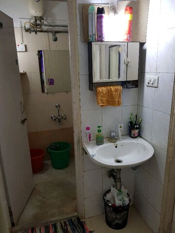 Bathroom in 1 BHK Apartment at Patil Raghukul Nagari CHS, Bopodi – for Rent
