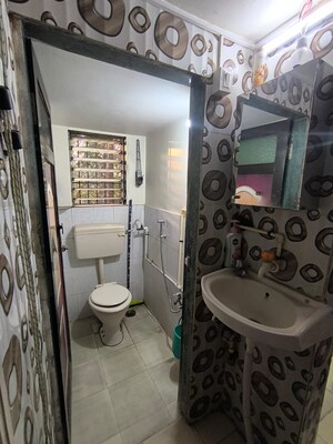 Bathroom in 2 BHK Apartment at Triveni Garden, Khadakpada – for Sale