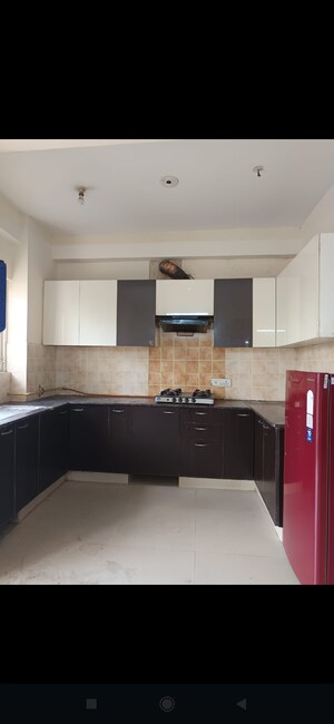 Kitchen in 3 BHK Apartment at Aims Golf City, Sector 75 – for Rent
