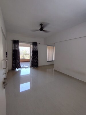 Living Room in 2 BHK Apartment at Pandit Javdekar Red Earth, Pirangut – for Rent