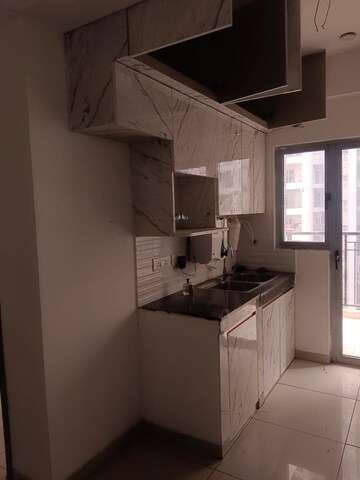 Kitchen in 2 BHK Apartment at Gulshan Bellina, Sector 16 Greater Noida – for Rent