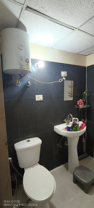 Bathroom in 1 RK Apartment at Aims Golf City, Sector 75 – for Rent