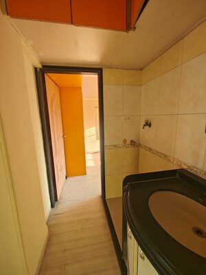 Kitchen in 2.5 BHK Apartment at Seawoods Sector 42 – for Rent