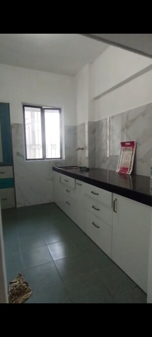 Kitchen in 1 BHK Apartment at Green Acres Apartment, Waghbil – for Rent