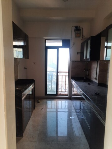 Kitchen in 3.5 BHK Apartment at Harmony Signature Towers, Owale – for Rent