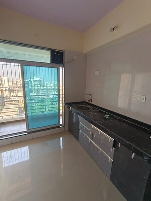 Kitchen in 2 BHK Apartment at Shubh Om Rudra Heights, Karanjade – for Rent