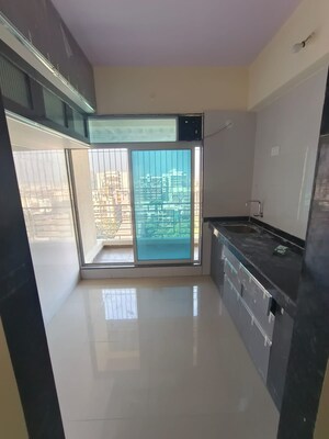 Kitchen in 2 BHK Apartment at Shubh Om Rudra Heights, Karanjade – for Rent