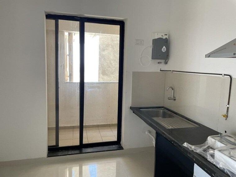 Kitchen, pride-world-city-kingsbury 3 Bedroom 1000 Sq.Ft. Apartment In Charholi Budruk Pune 9676496