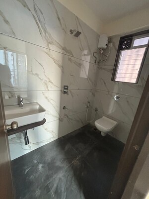 Kitchen in 2 BHK Apartment at SL Nandanvan Mohan CHS, Dahisar East – for Rent