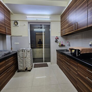 Kitchen in 2 BHK Apartment at Divine Ambrosia Apartment, Devi Pada – for Sale