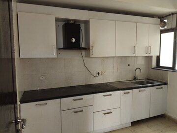 Kitchen in 2 BHK Apartment at Unitech Uniworld Resorts-The Residences, Sector 33 – for Rent