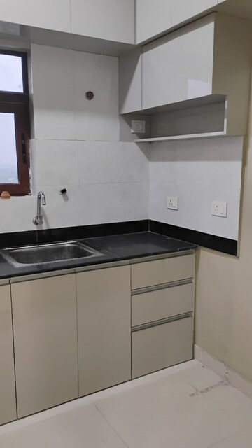 Kitchen in 3 BHK Apartment at Natural Awas, Chinar Park – for Rent