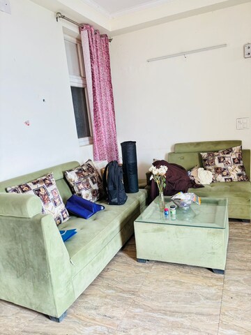 Living Room in 2 BHK Apartment at Aims Golf City, Sector 75 – for Rent
