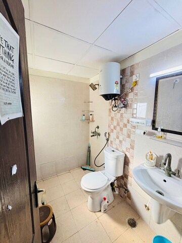Bathroom in 2 BHK Apartment at Aims Golf City, Sector 75 – for Rent