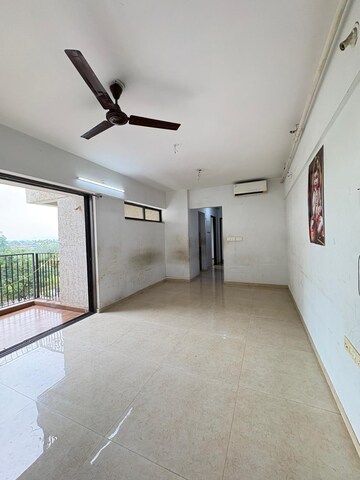 Living Room in 2 BHK Apartment at Lodha Lakeshore Greens, Dombivli East – for Rent