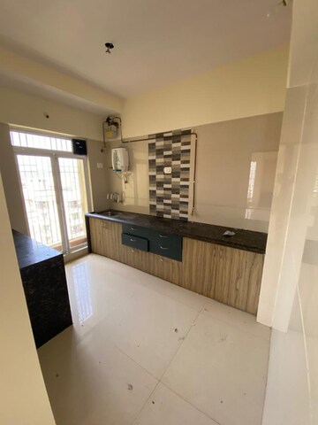 Kitchen in 2 BHK Apartment at Kiran Towers, Malad West – for Sale