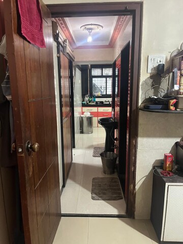 Living Room in 1 BHK Apartment at Kopar Khairane – for Sale