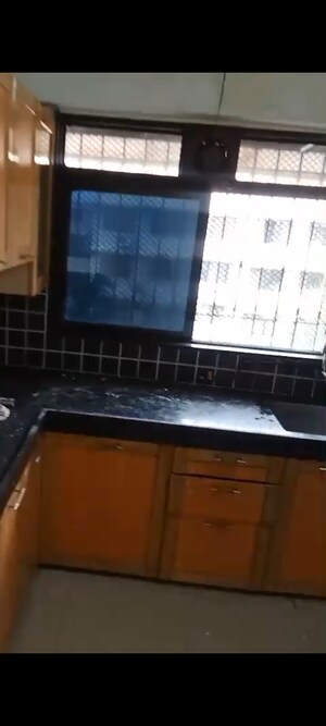 Kitchen in 1 BHK Apartment at Ajay Sahawas Apartment, Vile Parle East – for Rent