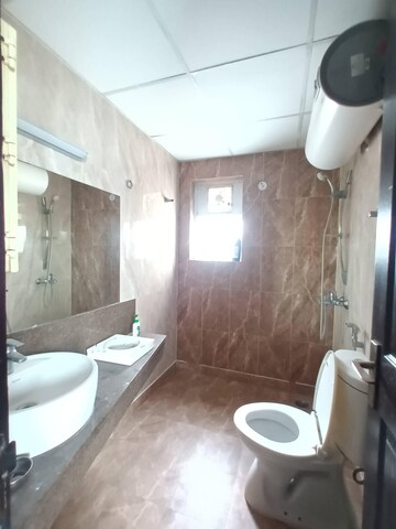 Bathroom in 3 BHK Apartment at ABA Cherry County, Tech Zone 4 Greater Noida – for Rent