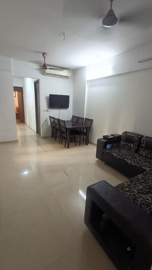 Living Room in 1 BHK Apartment at Lodha Palava Downtown, Dombivli East – for Rent