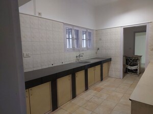 Kitchen in 3 BHK Apartment at New Chanakya CHS, Boat Club Road – for Rent