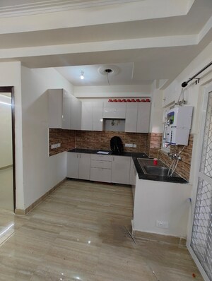 Kitchen in 2 BHK Apartment at Amrapali Tropical Garden, Tech Zone 4 Greater Noida – for Rent