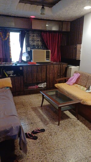 Living Room in 1 BHK Apartment at The Vivekanand CHS, Mahim – for Rent