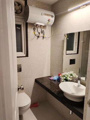 Bathroom in 2 BHK Apartment at Chandra Panorama, Sushant Golf City – for Rent