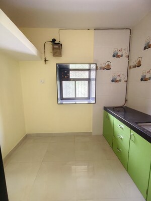 Kitchen in 1 BHK Apartment at Gokuldham Complex, Goregaon East – for Rent