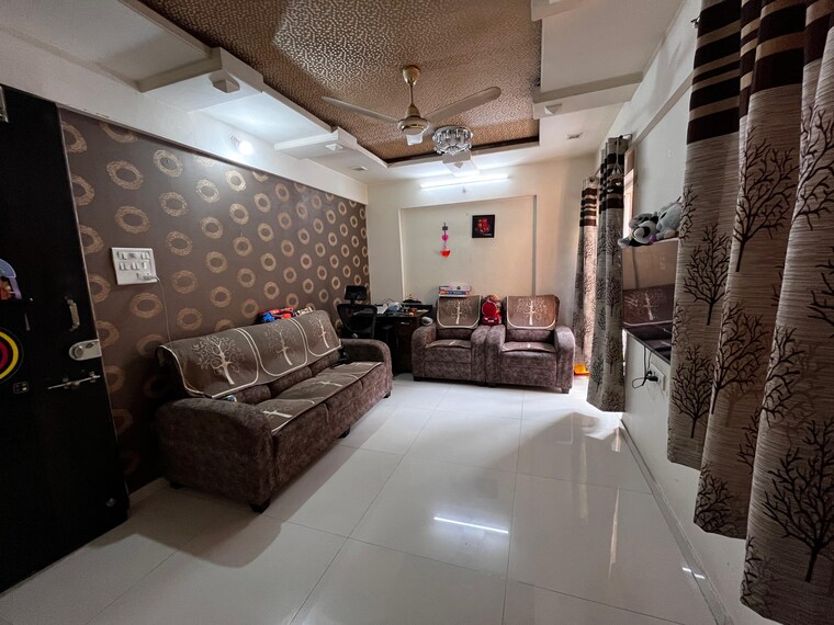 Living Room, gk-royale-rahadki-greens-phase-2 1 Bedroom 623 Sq.Ft. Apartment In Rahatani Pune 9690560