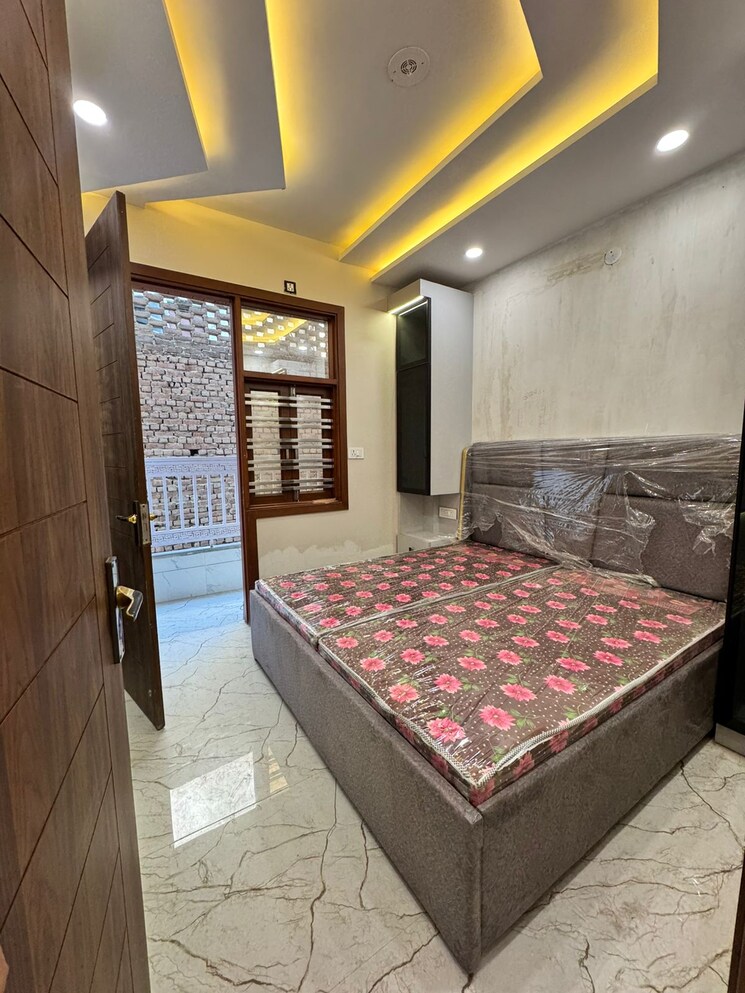 Bedroom, dwarka mor 3 Bedroom 85 Sq.Yd. Builder Floor In Dwarka Mor Delhi 9691150
