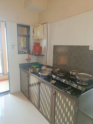 Kitchen in 2 BHK Apartment at Yogi Ratna Apartments, Borivali West – for Sale
