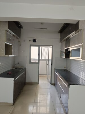 Kitchen in 3 BHK Apartment at Gulshan Bellina, Sector 16 Greater Noida – for Rent