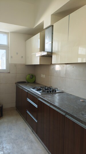 Kitchen in 3 BHK Apartment at Puri Anand Villas Phase II, Sector 81 – for Rent