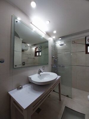 Bathroom in 2 BHK Apartment at Ambience Island, Sector 24 – for Sale