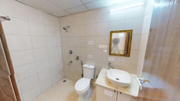 Bathroom in 2 BHK Apartment at Bhartiya City Nikoo Homes II, Thanisandra Main Road – for Sale