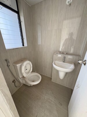 Bathroom in 3 BHK Apartment at Runwal Gardens Phase 2, Dombivli East – for Rent