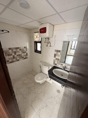 Bathroom in 2 BHK Apartment at Cosmos Express 99, Sector 99 – for Rent