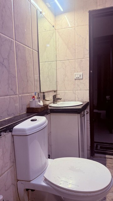 Bathroom in 3 BHK Apartment at Mahagun Mirabella, Sector 79 – for Rent