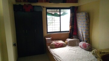 Bedroom in 2 BHK Apartment at Guru Ganesh Nagar Society, Kothrud – for Rent