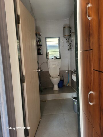 Bathroom in 2 BHK Apartment at Lok Upvan I, Manpada – for Sale