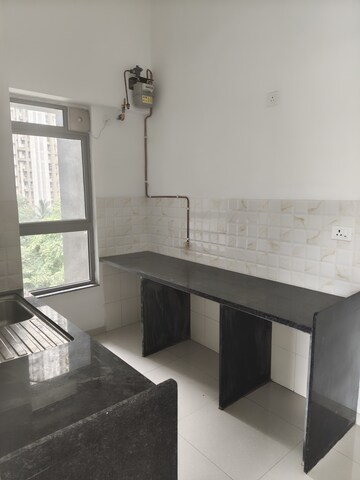 Kitchen in 2 BHK Apartment at Unnathi Woods Phase 3, Ghodbunder Road – for Rent