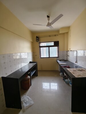 Kitchen in 3 BHK Apartment at Maharaja Retreat CHS, Goregaon East – for Rent
