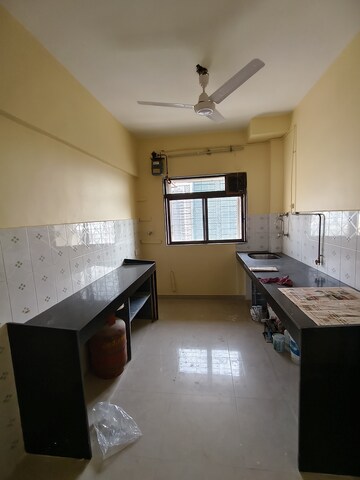 Kitchen in 3 BHK Apartment at Maharaja Retreat CHS, Goregaon East – for Rent
